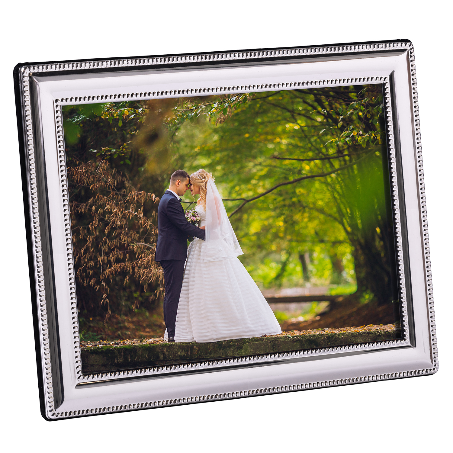 Silver plated picture frame displaying an 8x10 photo on a living room console